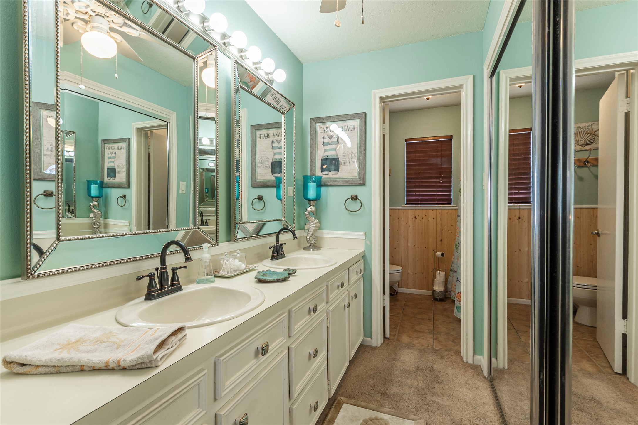 3 Pelican La Marque, TX 77568 - Photo 15 of 46 a spacious bathroom with a double vanity sink and a mirror