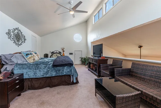 an aerial view of a house with a garden and lake view