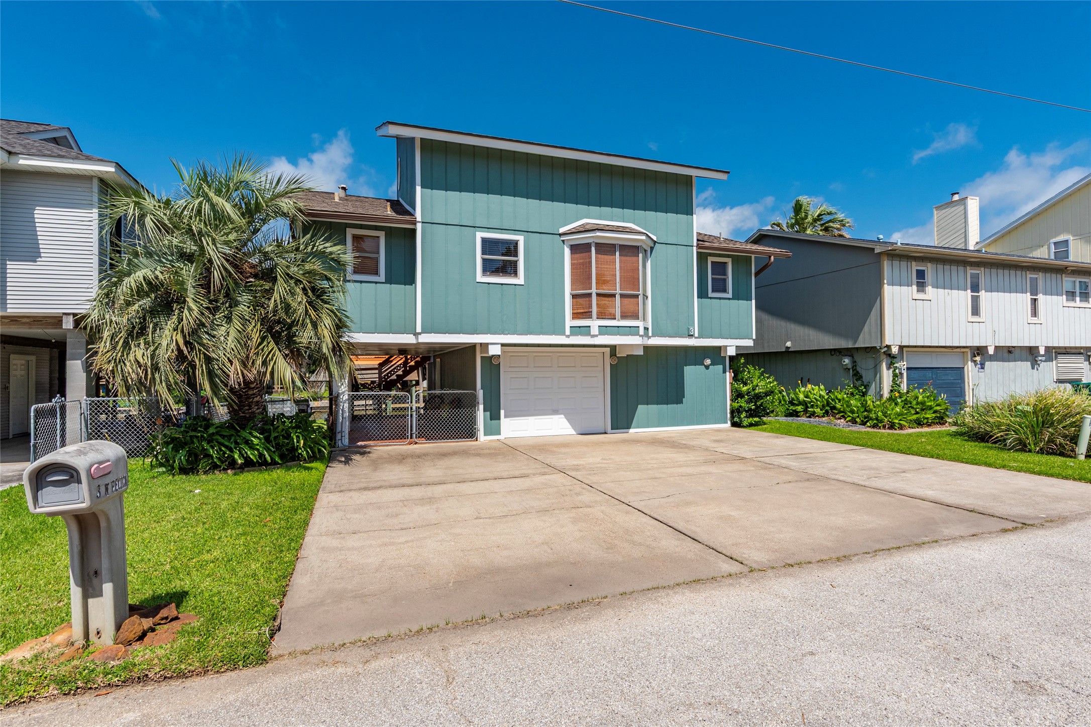 3 Pelican La Marque, TX 77568 - Photo 24 of 46 a front view of a house with a yard and a garage