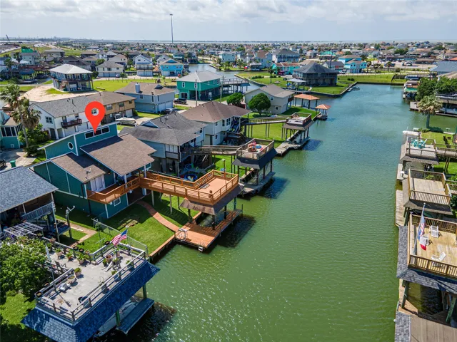 a living room with furniture a fireplace and wooden floor