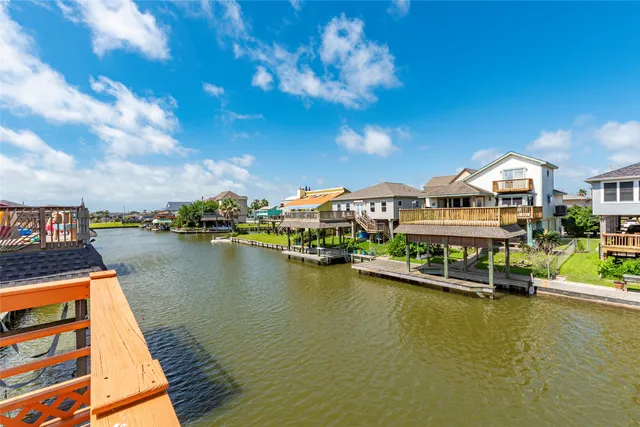 a view of a patio with swimming pool table and chairs