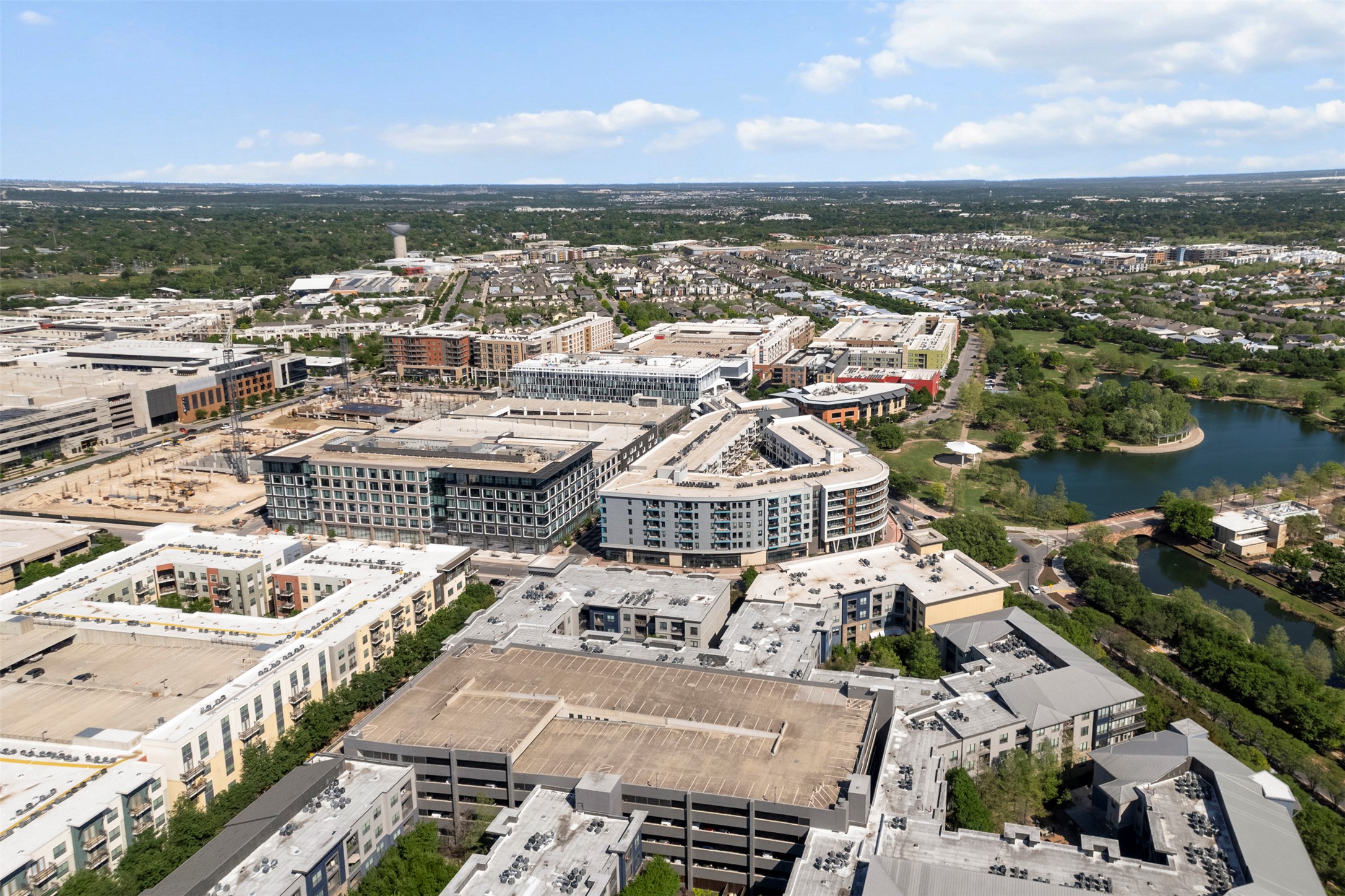 1701 Simond Avenue, Unit 418 Austin, TX 78723 - Photo 34 of 37 Drone / aerial view with a water view and a city view.