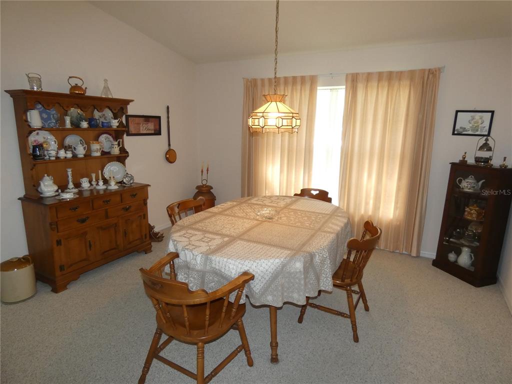 8365 Boyce Street Spring Hill, FL 34606 - Photo 18 of 38 a dining room with furniture and window