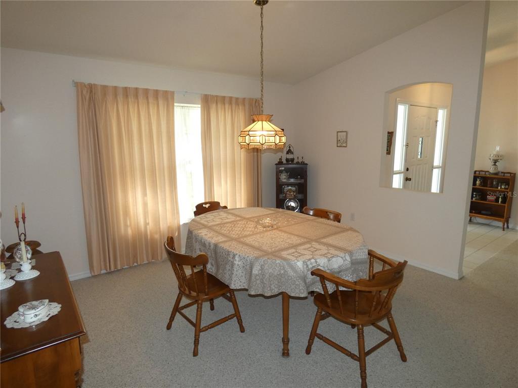 8365 Boyce Street Spring Hill, FL 34606 - Photo 20 of 38 a dining room with furniture and window
