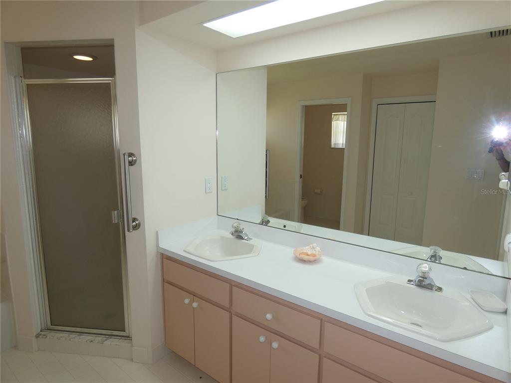 8365 Boyce Street Spring Hill, FL 34606 - Photo 28 of 38 a bathroom with a sink and a mirror