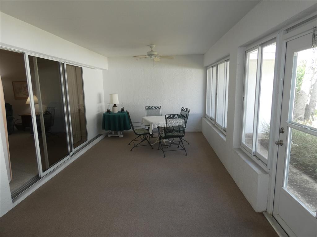 8365 Boyce Street Spring Hill, FL 34606 - Photo 8 of 38 a dining room with furniture and a window