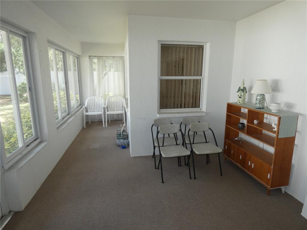 8365 Boyce Street Spring Hill, FL 34606 - Photo 9 of 38 a living room with furniture and a window