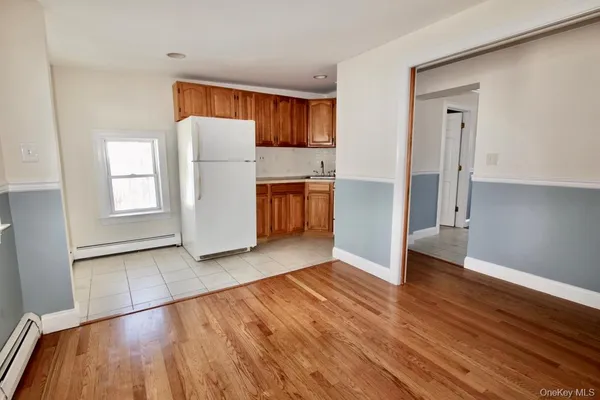 a view of kitchen with furniture and wooden floor