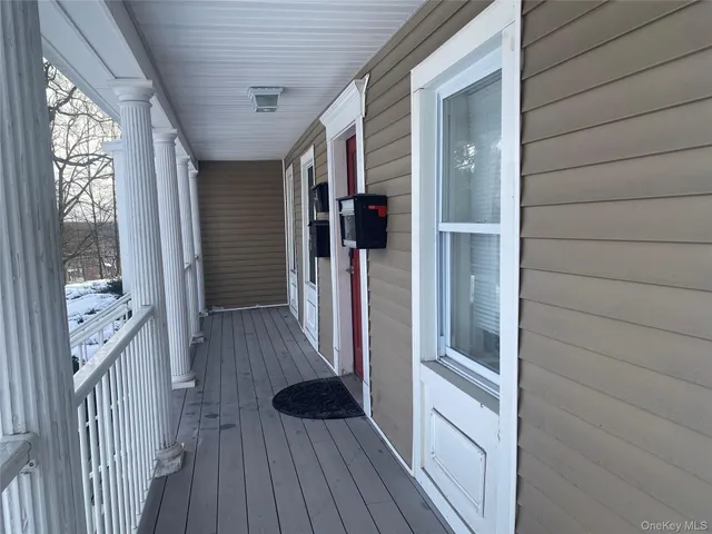 a view of walk in closet with wooden floor