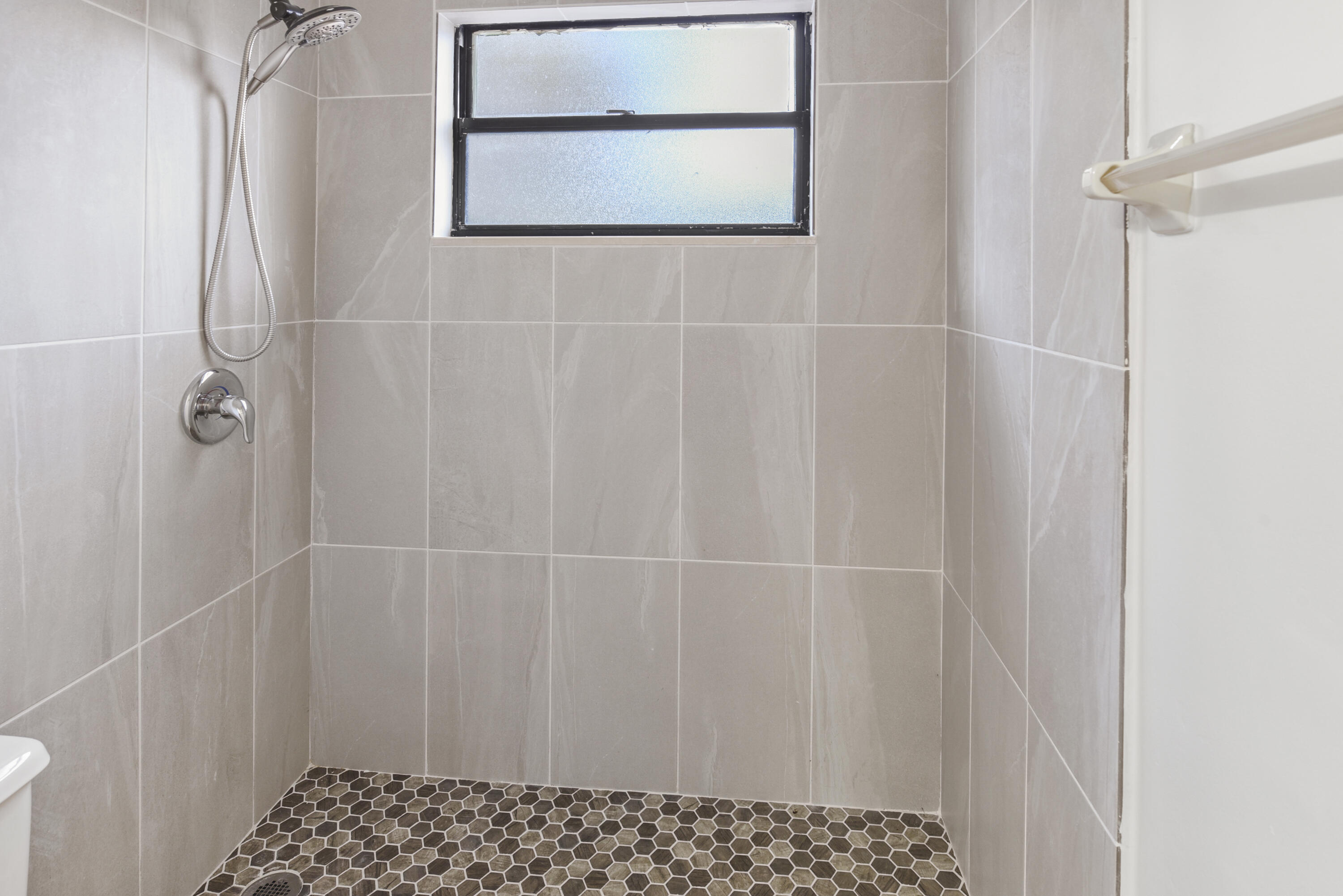 5666 Southeast Matousek Street Stuart, FL 34997 - Photo 21 of 49 a bathroom with a shower and a sink