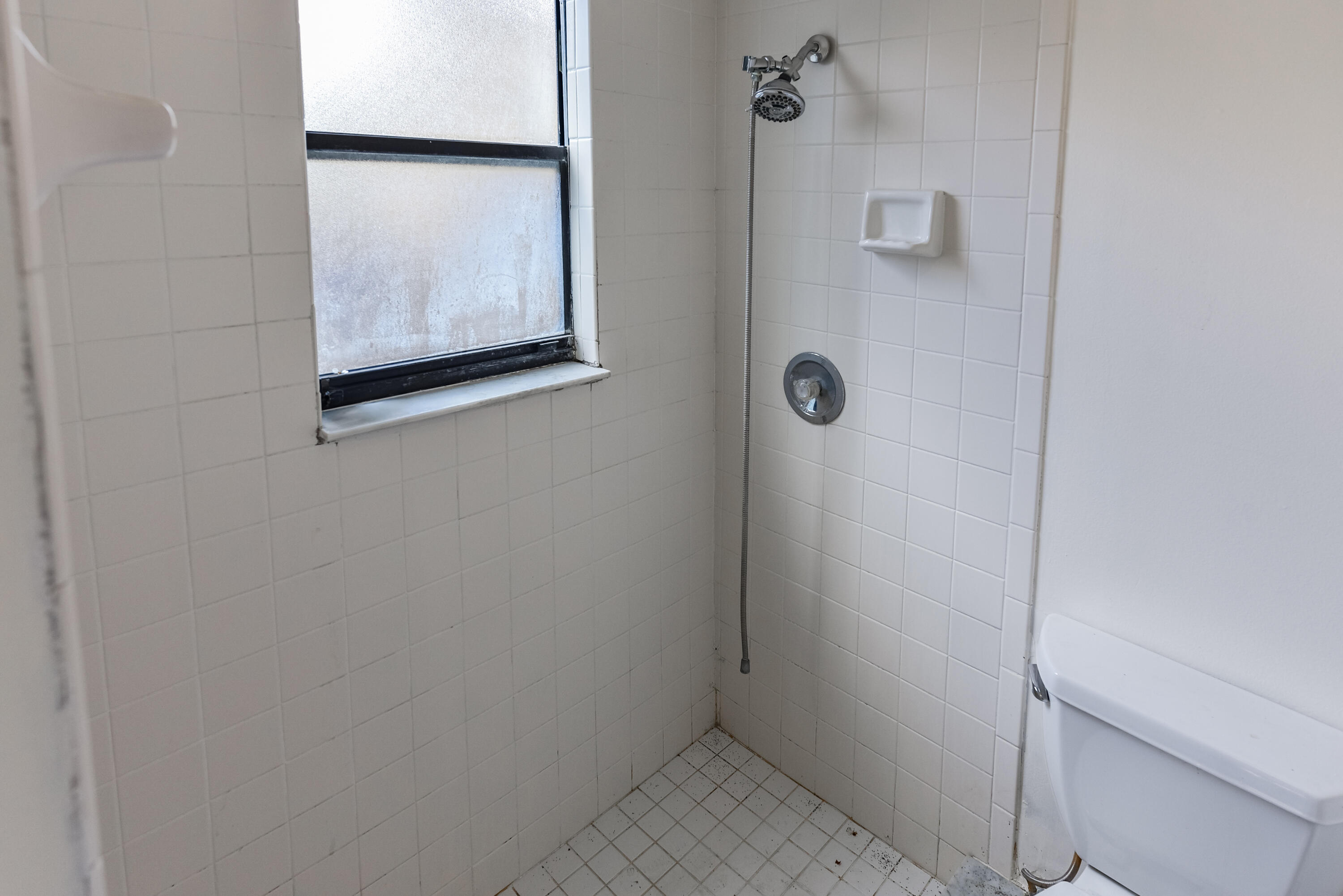 5666 Southeast Matousek Street Stuart, FL 34997 - Photo 22 of 49 a bathroom with a shower