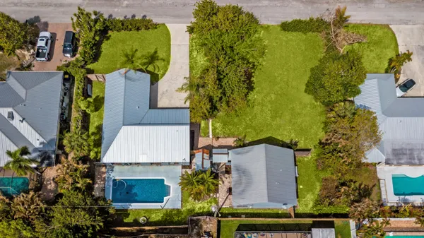 an aerial view of a house with a garden