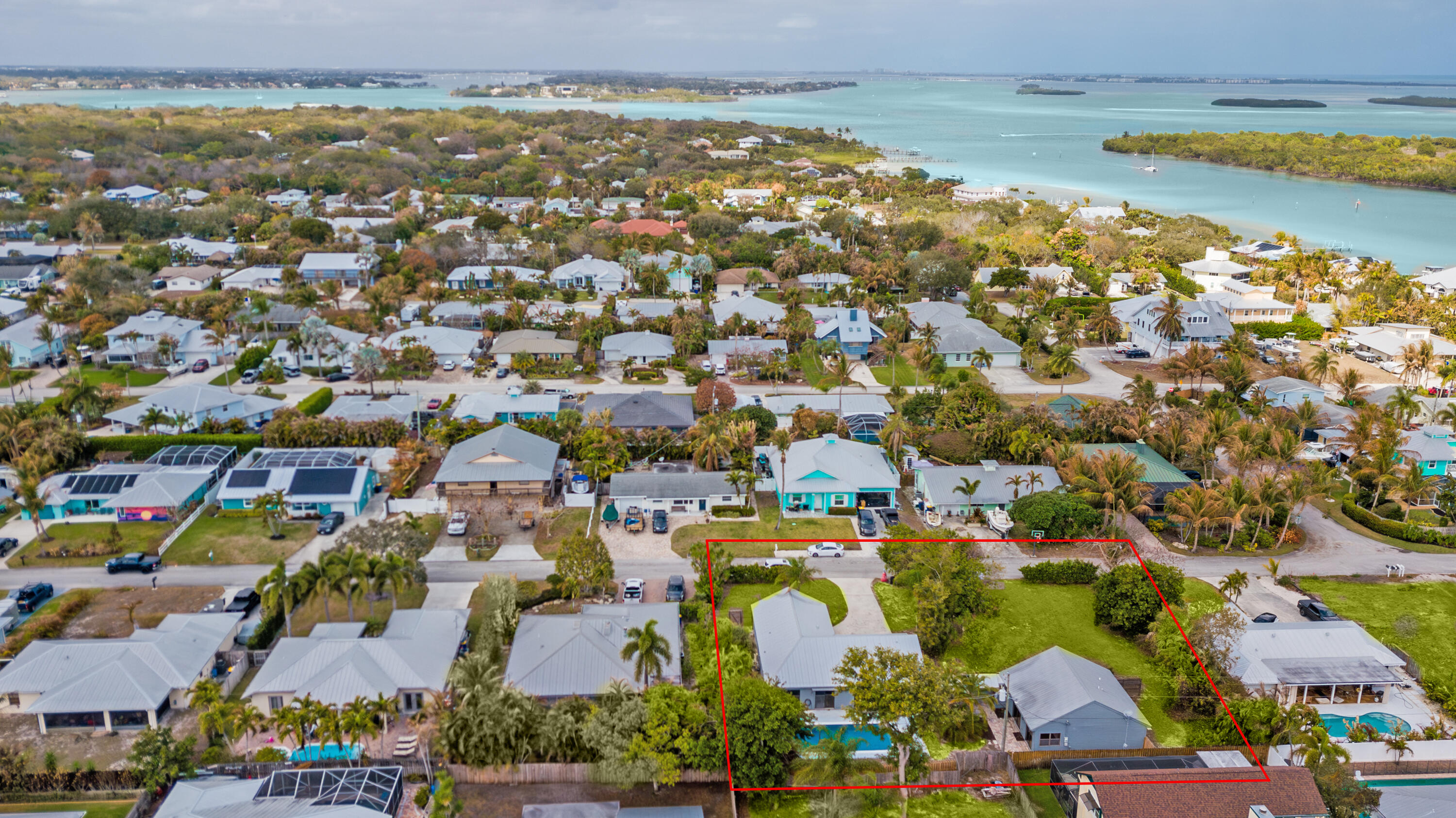 5666 Southeast Matousek Street Stuart, FL 34997 - Photo 37 of 49 an aerial view of residential building with outdoor space