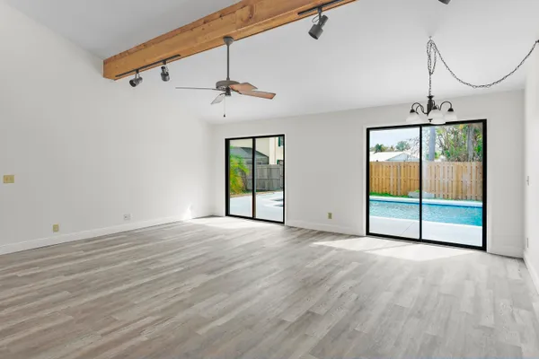 a view of an empty room with a window
