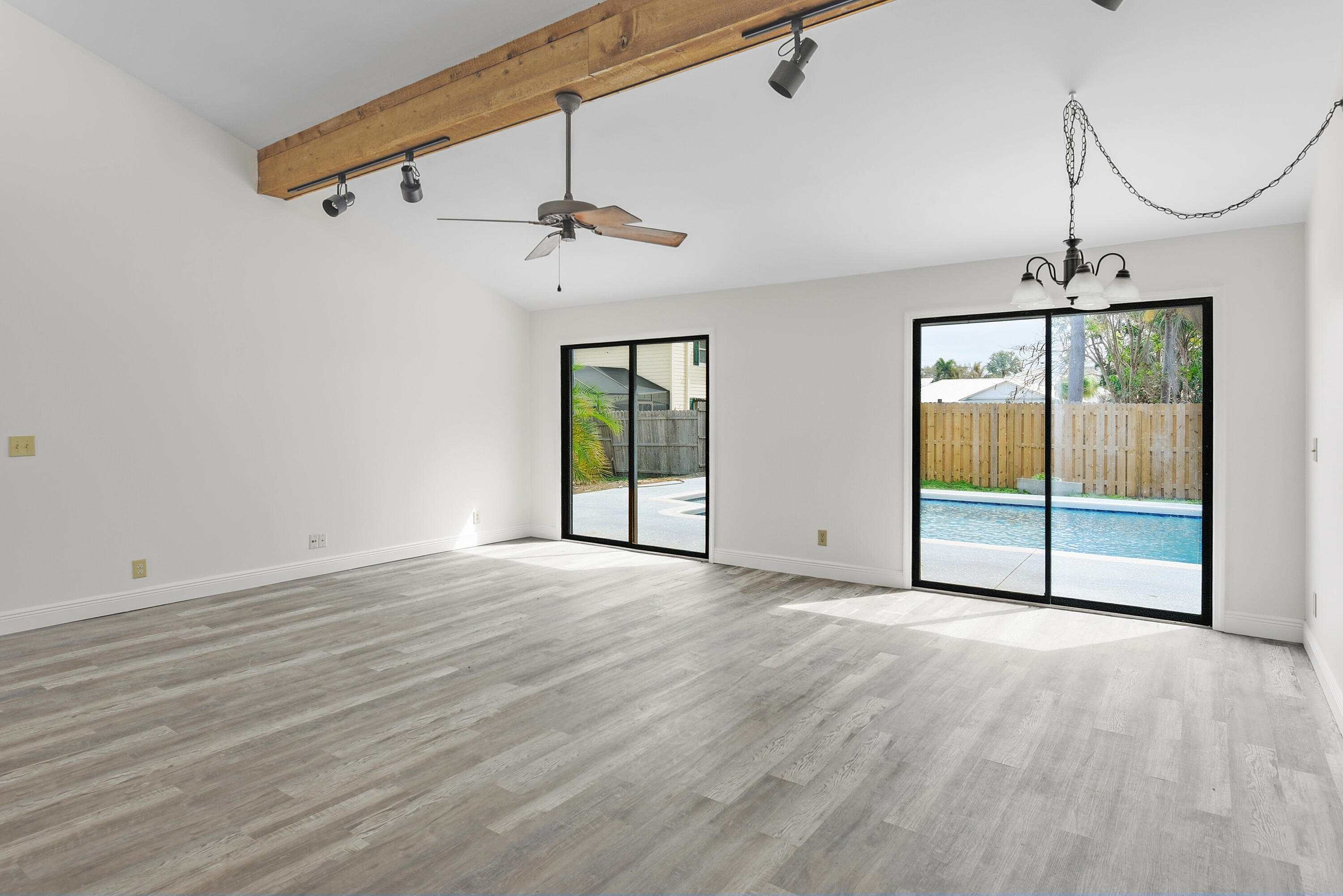 5666 Southeast Matousek Street Stuart, FL 34997 - Photo 7 of 49 a view of an empty room with a window