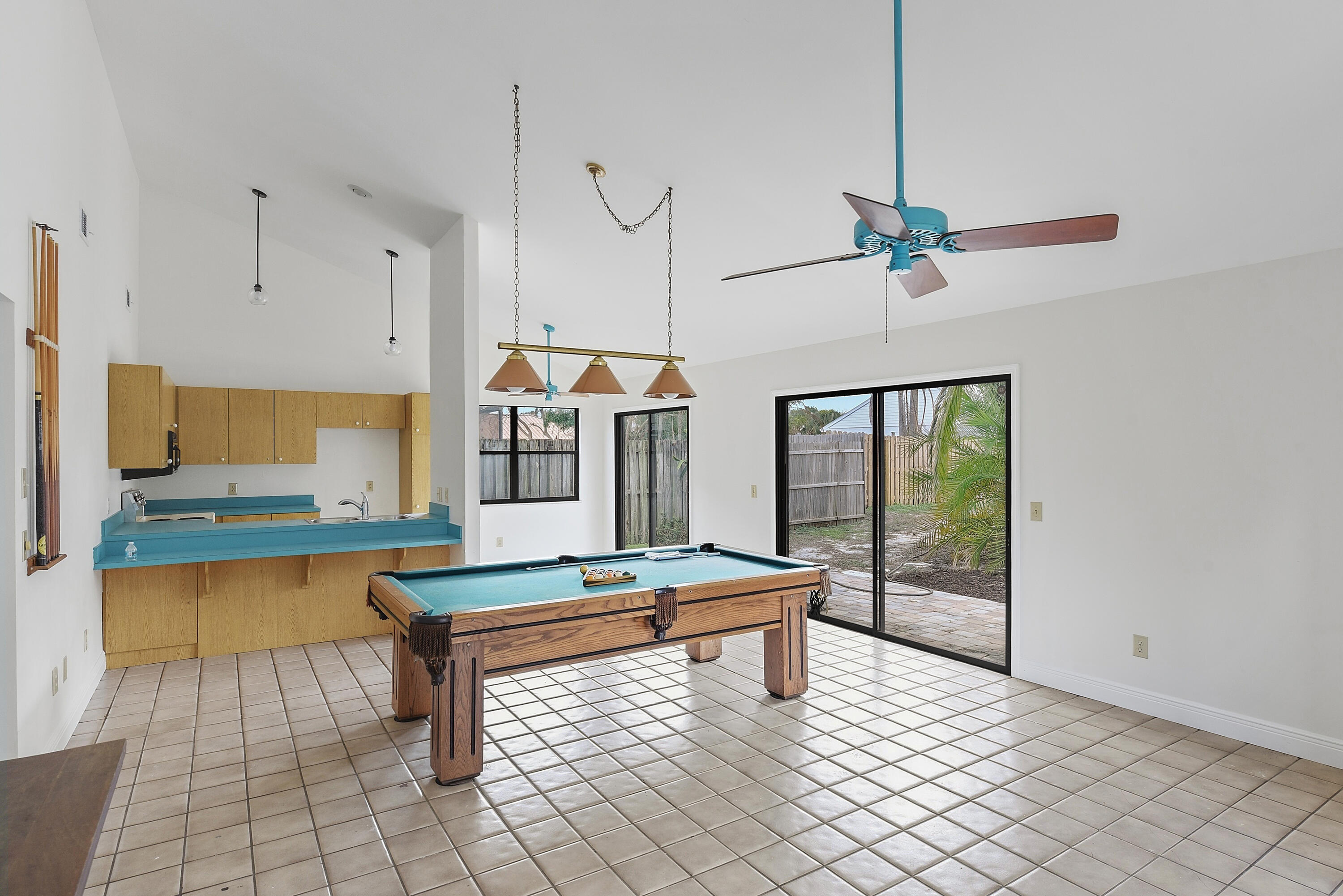 5666 Southeast Matousek Street Stuart, FL 34997 - Photo 10 of 49 a room with pool table and windows