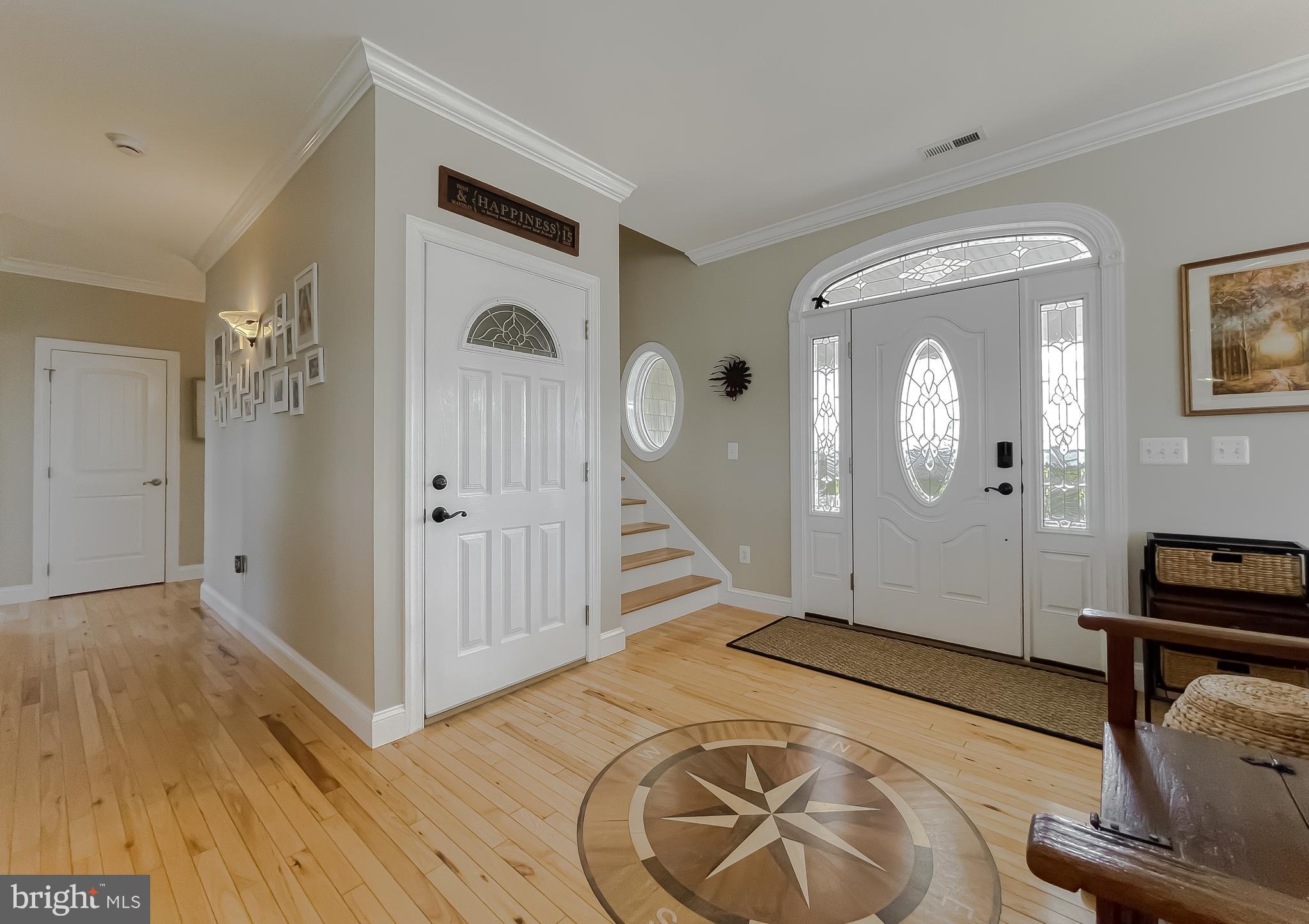16165 Piney Point Road Piney Point, MD 20674 - Photo 8 of 86 Foyer with Custom Inlay Compass Rose Medallion