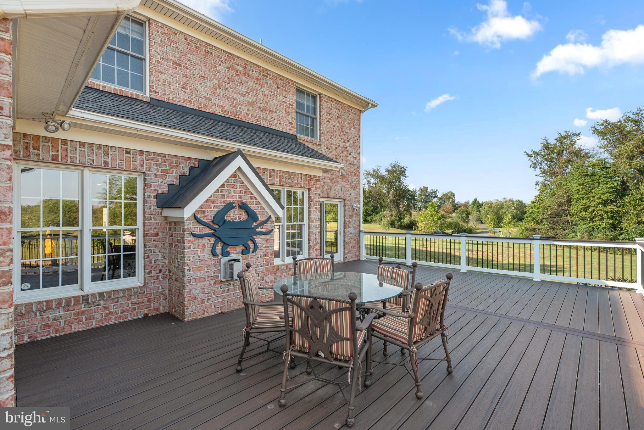 15421 Conrad Spring Road Boyds, MD 20841 - Photo 54 of 62 a view of a chairs and table on the wooden floor