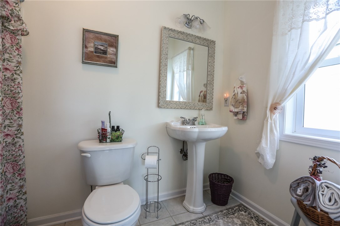 83 Angels Path Penfield, NY 14580 - Photo 12 of 36 Partial view of the 1st floor full bath with tile