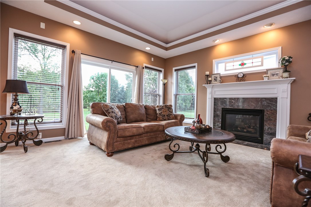 83 Angels Path Penfield, NY 14580 - Photo 14 of 36 Family room with slider to the back patio, gas fir