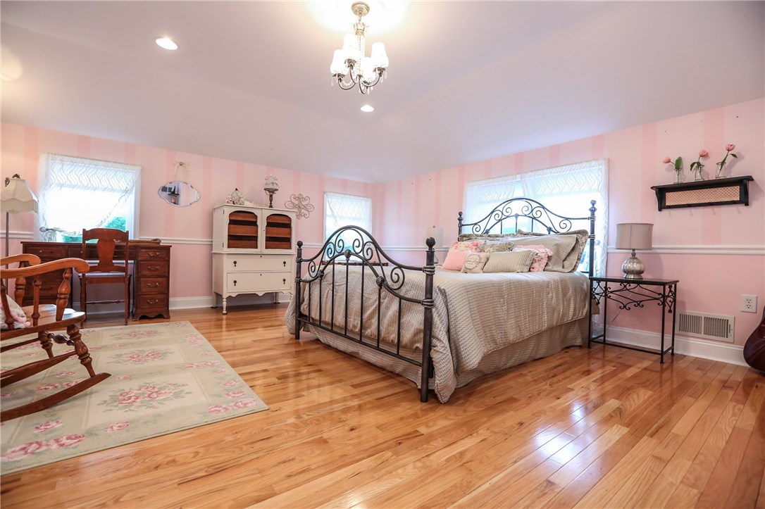 83 Angels Path Penfield, NY 14580 - Photo 25 of 36 Magnificent second floor bedroom space with hardwo
