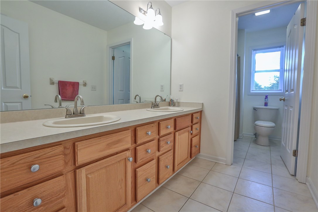 83 Angels Path Penfield, NY 14580 - Photo 28 of 36 Upstairs family bath with double sink vanity, ampl