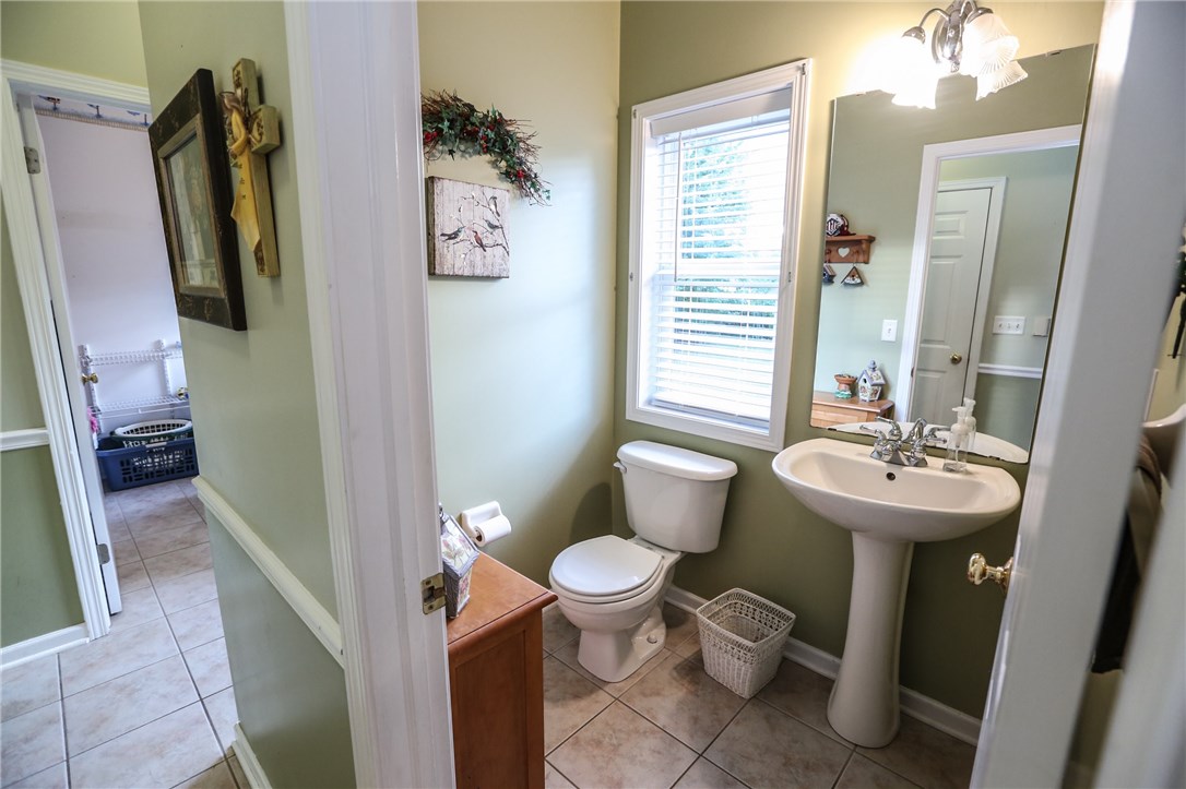 83 Angels Path Penfield, NY 14580 - Photo 31 of 36 Main level powder room off the back hall adjacent