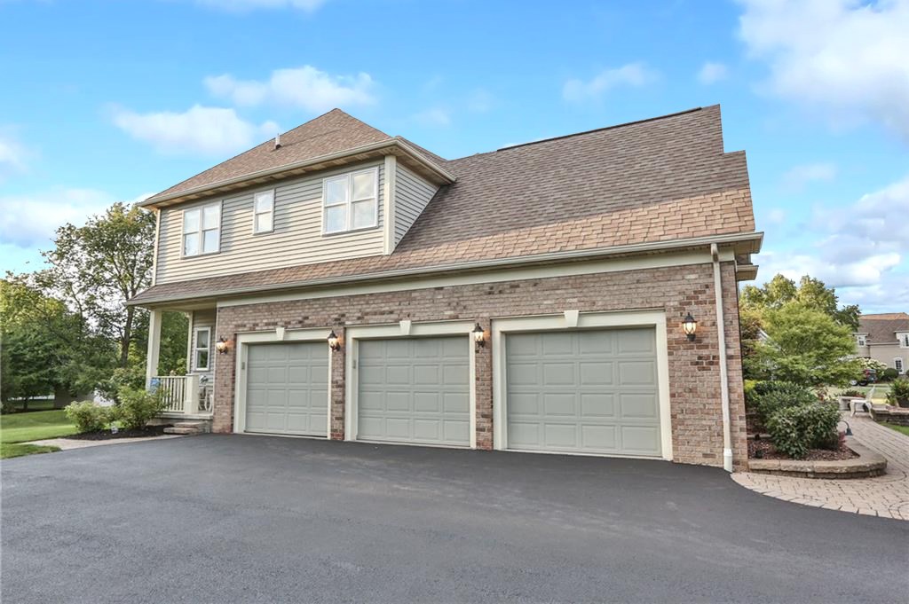 83 Angels Path Penfield, NY 14580 - Photo 33 of 36 3-car side load entry garage with level driveway,