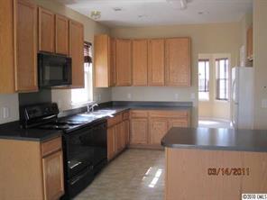 6308 Trotters Ridge Road Charlotte, NC 28227 - Photo 2 of 11 a kitchen with stainless steel appliances granite countertop a stove a sink and a microwave