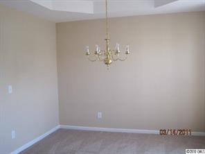 6308 Trotters Ridge Road Charlotte, NC 28227 - Photo 3 of 11 a room with a chandelier