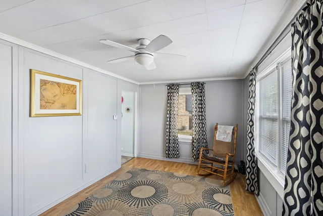 a view of a livingroom with furniture and a window
