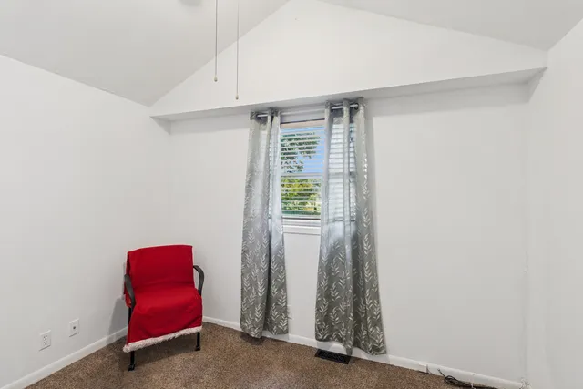 a view of room with air conditioner and window