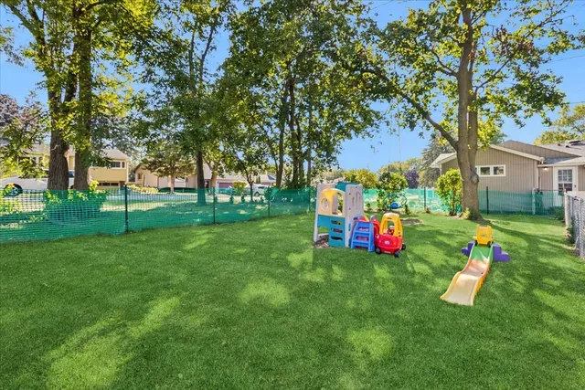 a view of a park with large trees