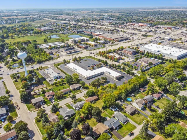 an aerial view of residential houses with outdoor space