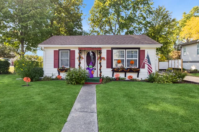 a front view of a house with garden