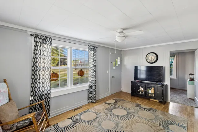 a living room with furniture and a window
