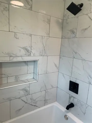 a bathroom with a sink and a bathtub