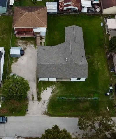 an aerial view of a house with a garden