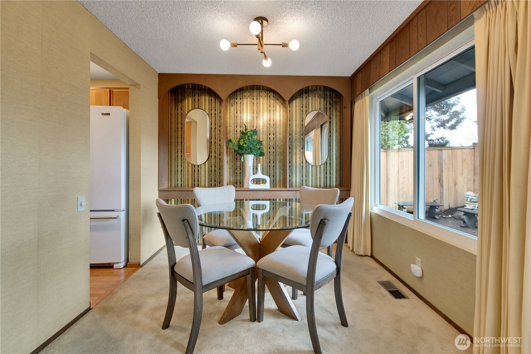 2005 Camas Court Southeast Renton, WA 98055 - Photo 13 of 31 a view of a dining room with furniture a chandelier and a window