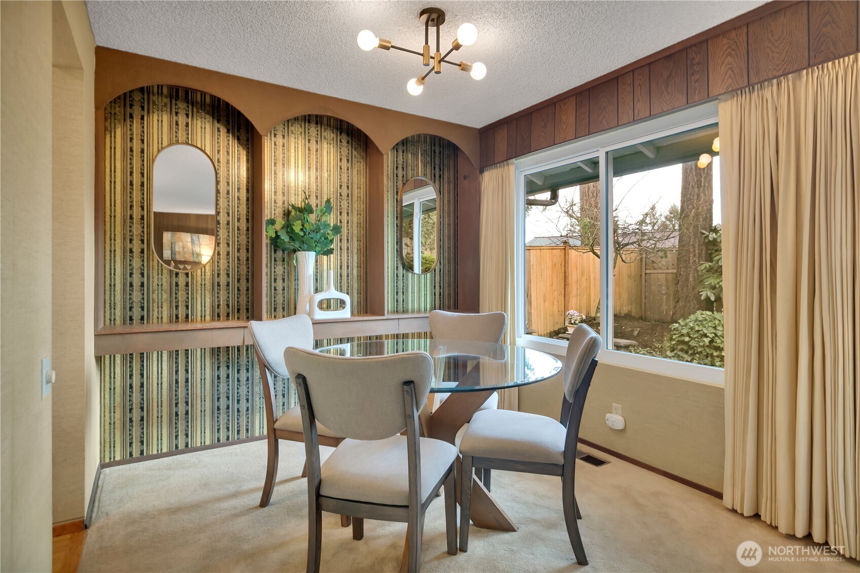 2005 Camas Court Southeast Renton, WA 98055 - Photo 14 of 31 a view of a dining room with furniture large windows and wooden floor