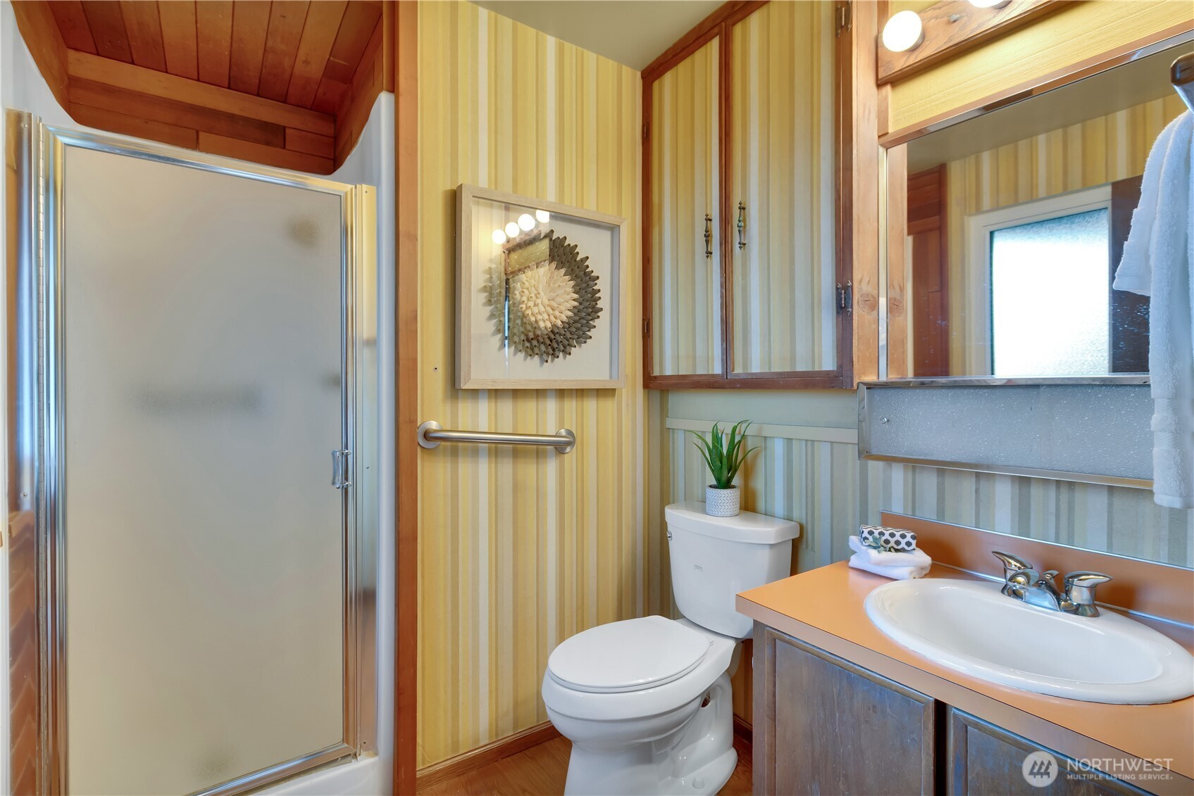 2005 Camas Court Southeast Renton, WA 98055 - Photo 19 of 31 a bathroom with a sink a toilet and a mirror