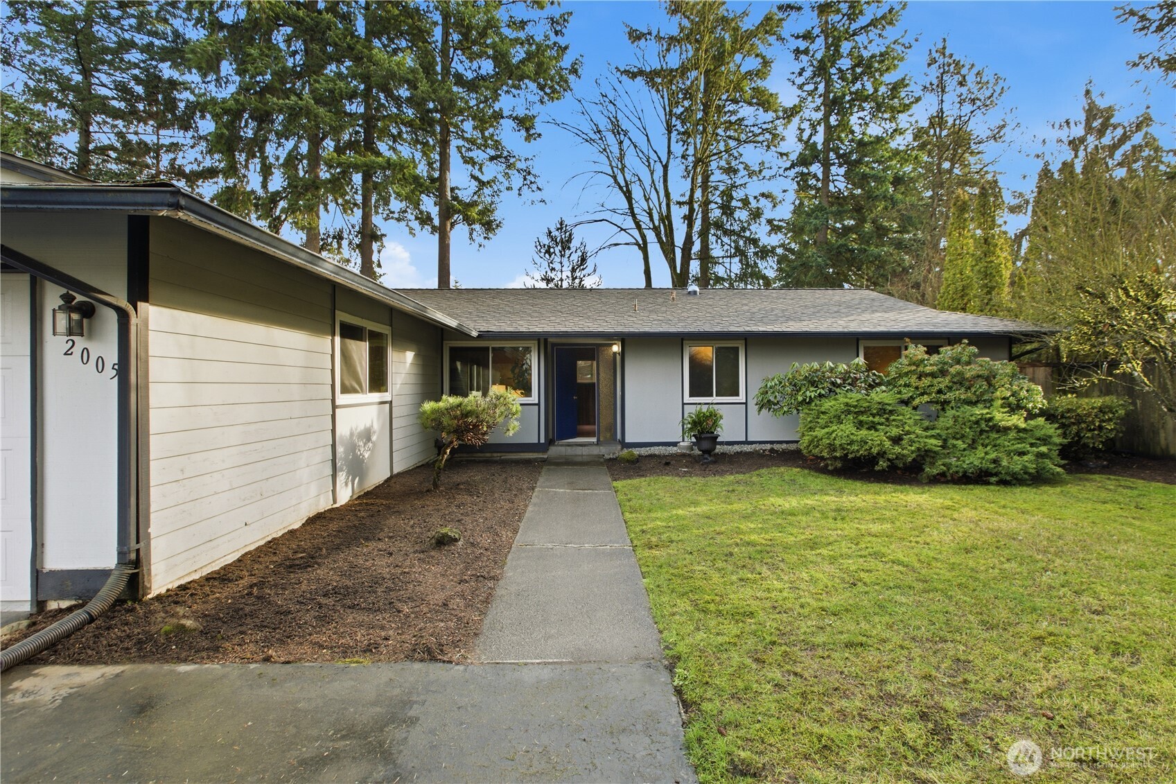 2005 Camas Court Southeast Renton, WA 98055 - Photo 2 of 31 a front view of a house with garden