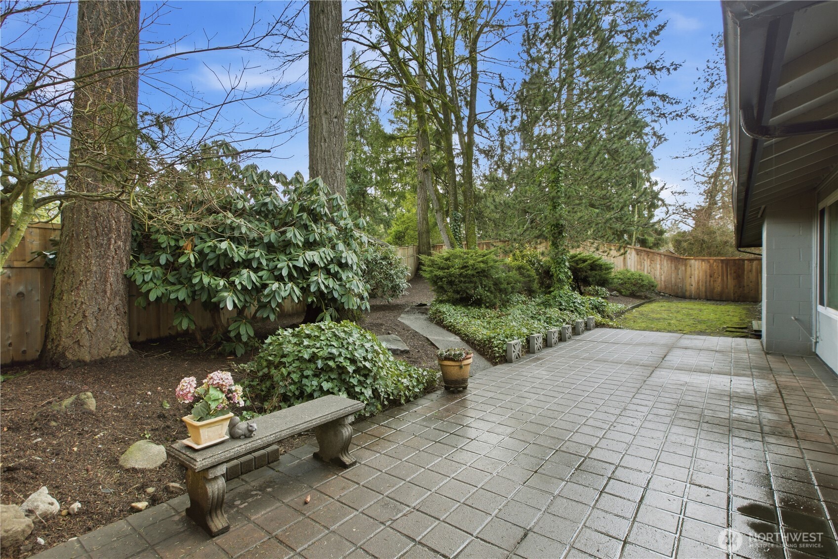 2005 Camas Court Southeast Renton, WA 98055 - Photo 26 of 31 a bench is sitting in the middle of a yard