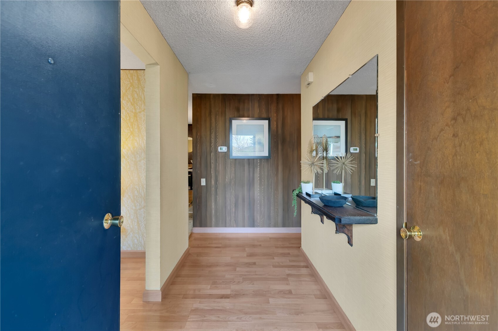 2005 Camas Court Southeast Renton, WA 98055 - Photo 3 of 31 a view of a hallway view with wooden floor and staircase