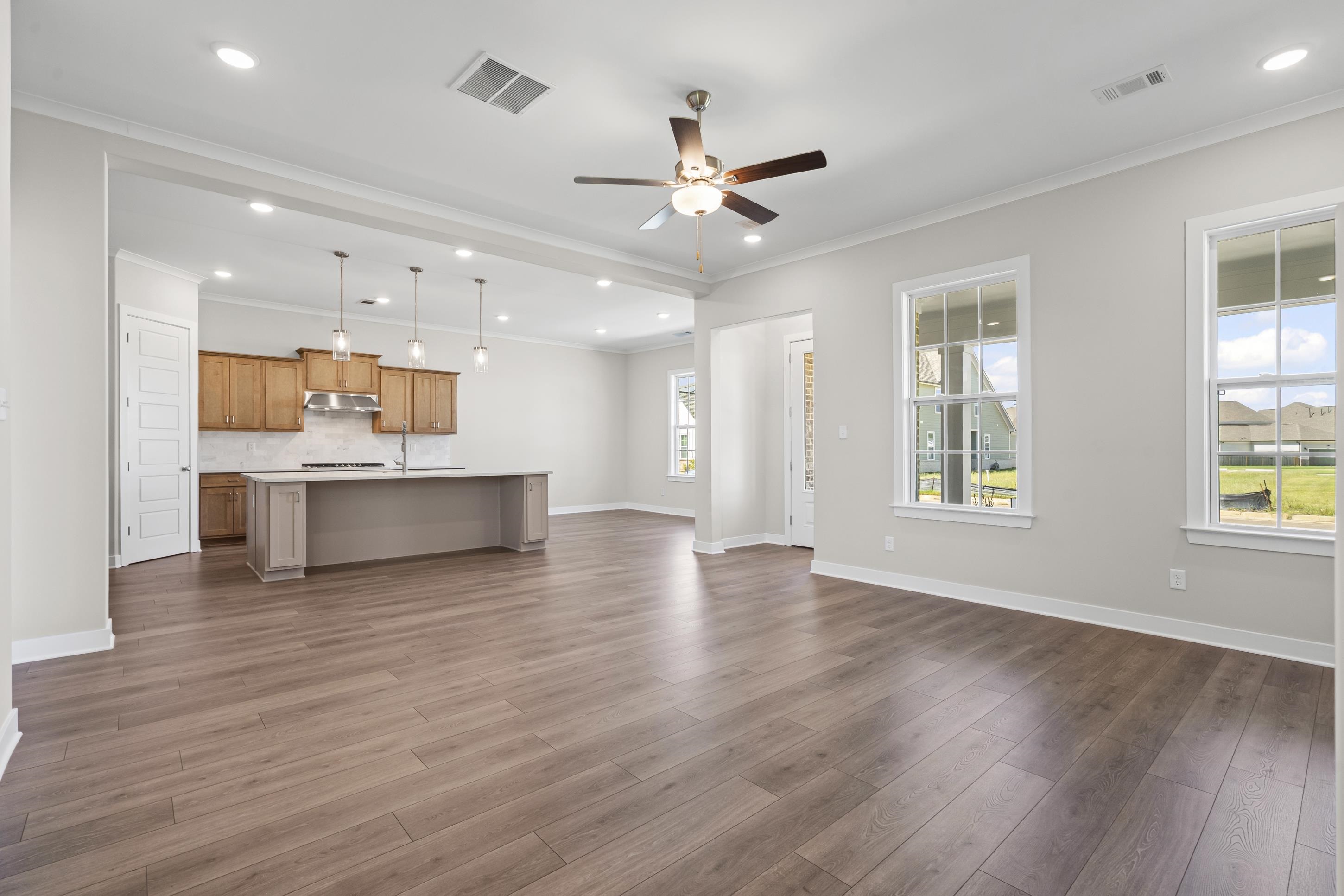 4824 Lyla Lane Collierville, TN 38017 - Photo 12 of 32 a view of an empty room with window and wooden floor
