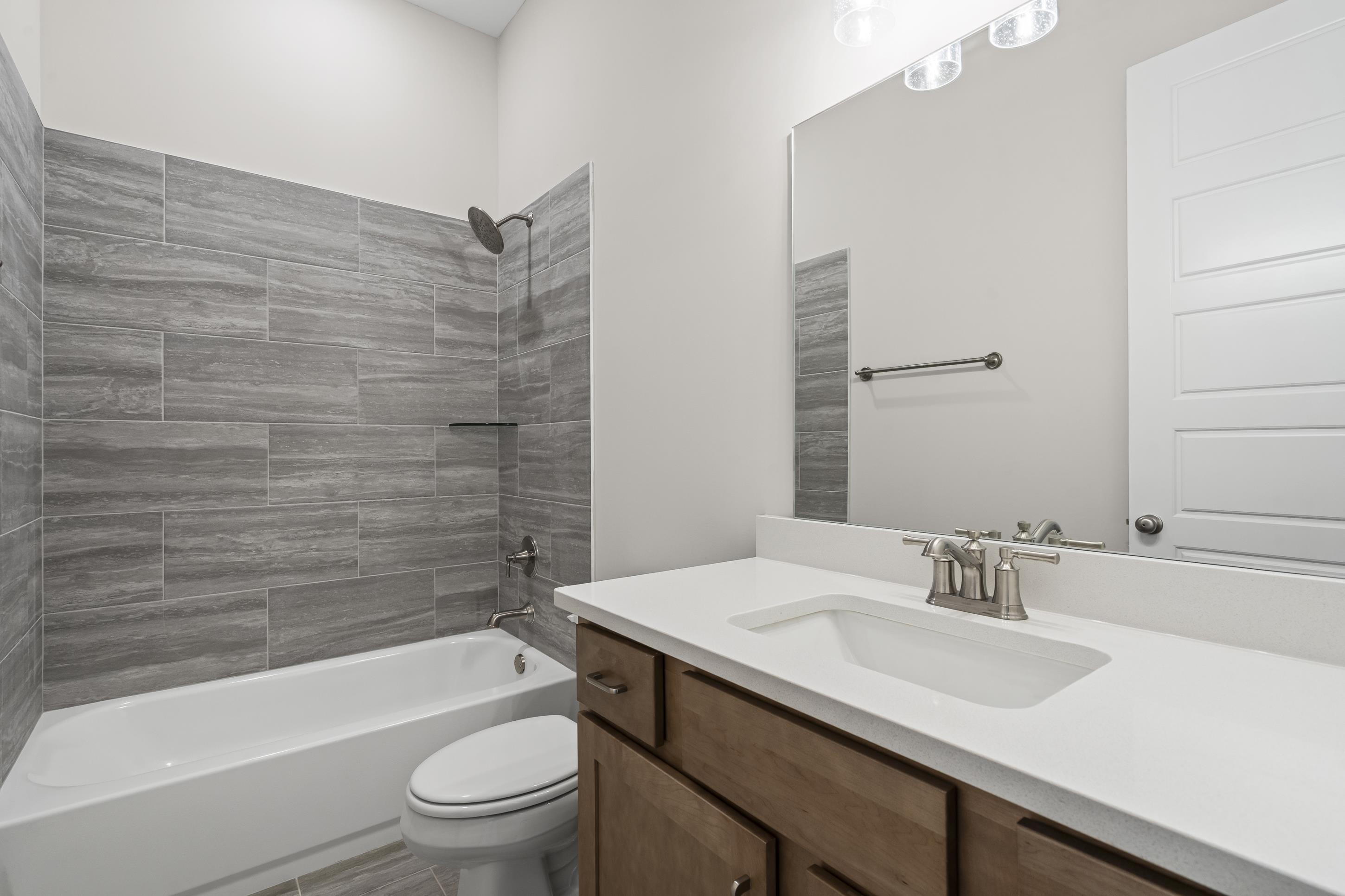 4824 Lyla Lane Collierville, TN 38017 - Photo 14 of 32 a bathroom with a sink toilet vanity and bathtub