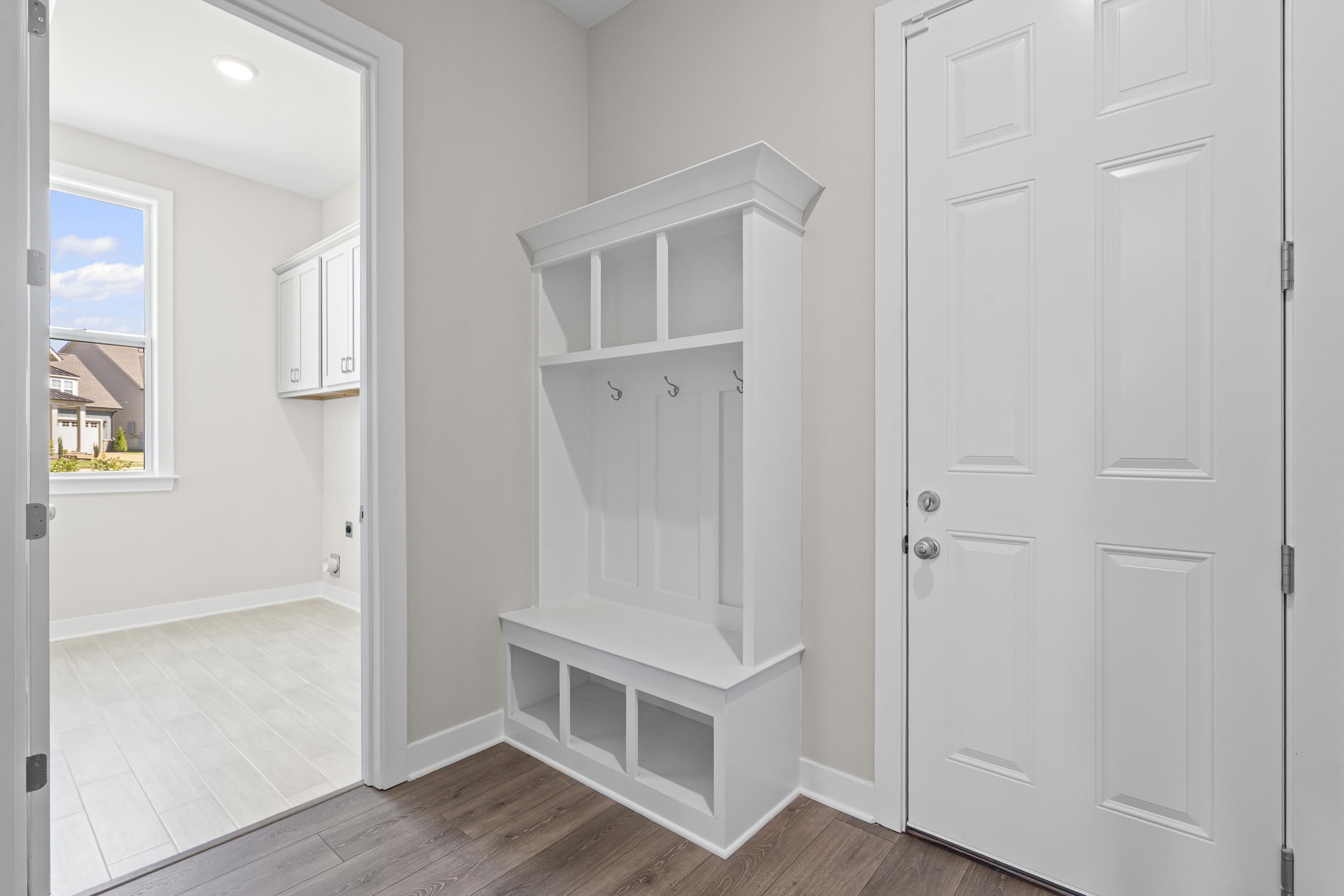 4824 Lyla Lane Collierville, TN 38017 - Photo 15 of 32 an entryway with wooden floor and cabinet
