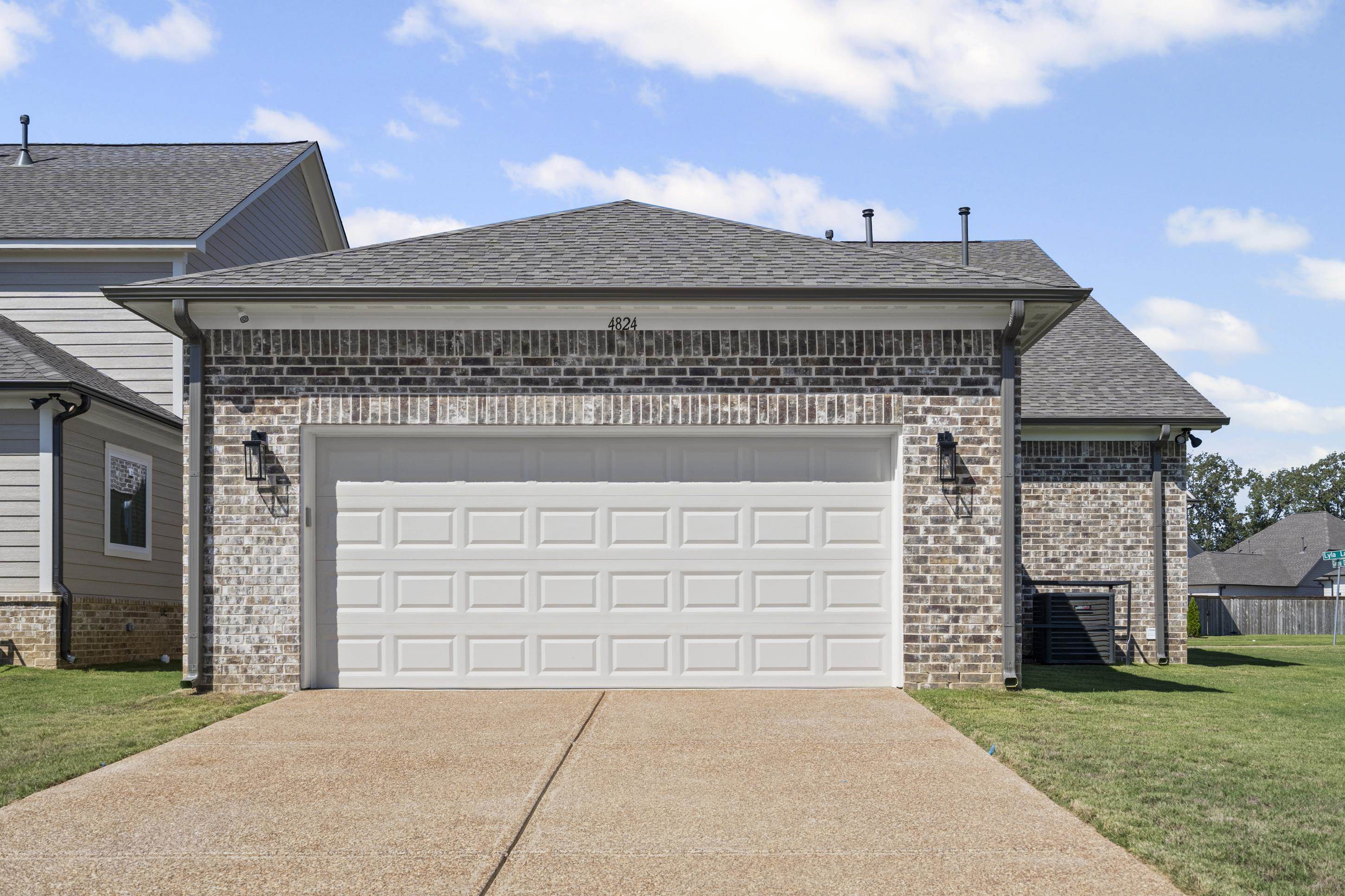 4824 Lyla Lane Collierville, TN 38017 - Photo 29 of 32 front view of a house with a garden