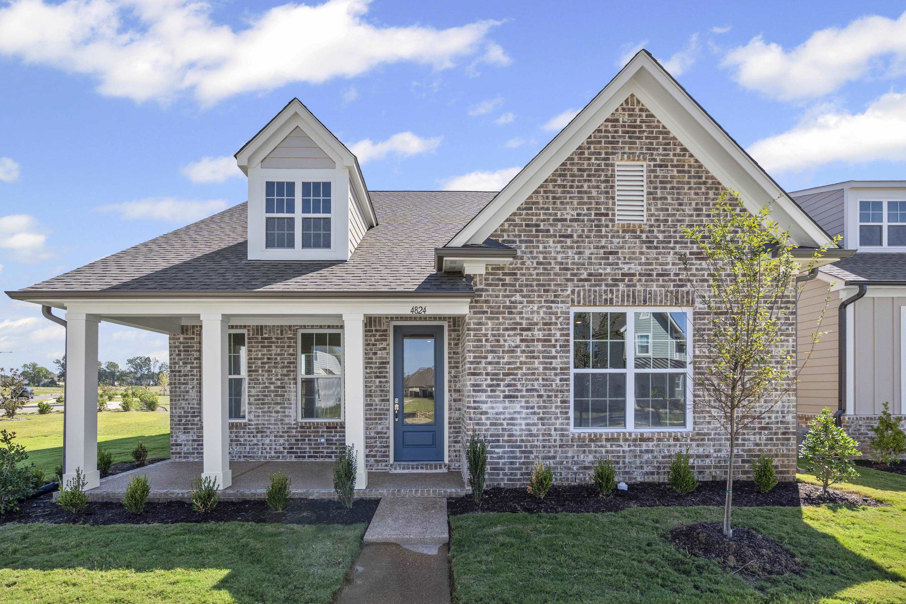 4824 Lyla Lane Collierville, TN 38017 - Photo 5 of 32 a front view of a house with garden