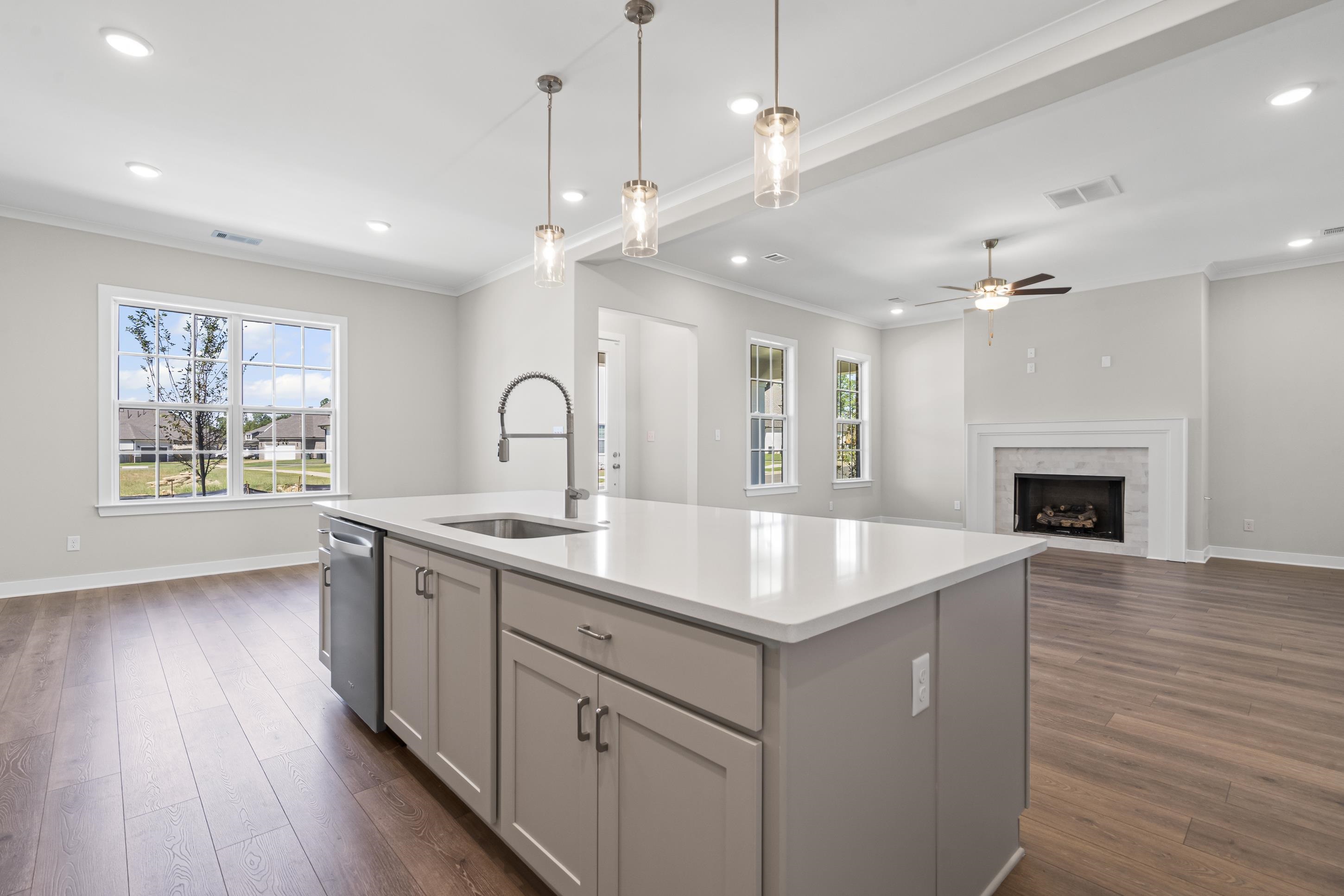 4824 Lyla Lane Collierville, TN 38017 - Photo 32 of 32 a hall with kitchen island a fireplace wooden floor and a window